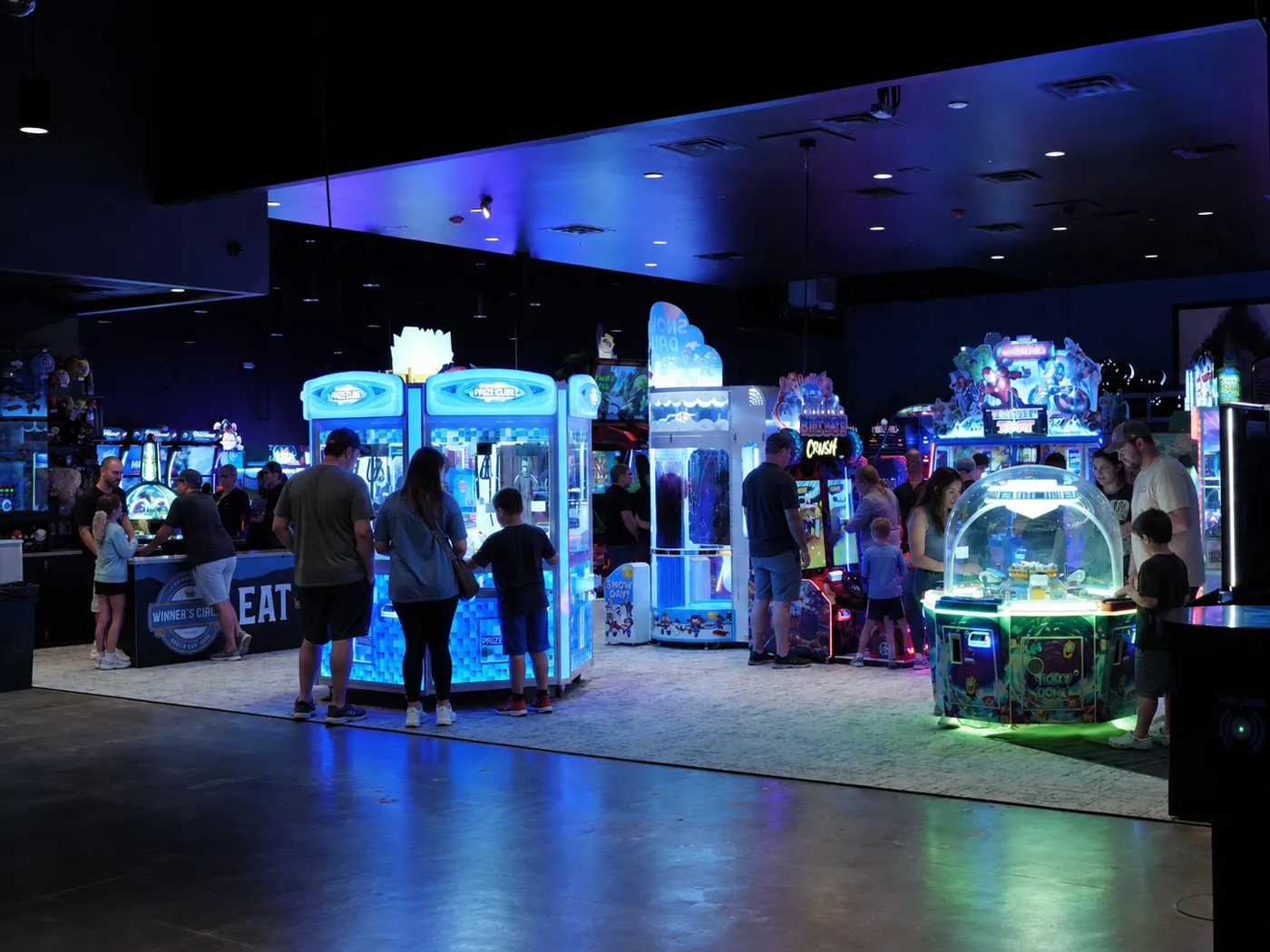 Families playing in the arcade